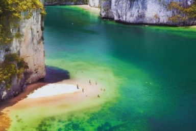 Halong Bay - Drum Cave - Me Cung Cave - Titop Island (B, L, D)